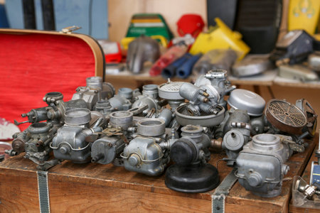 Various motorcycle engine parts, made of metal, steel, or iron. You can see engine blocks,...