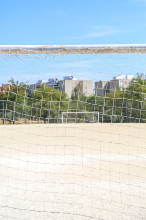 A dirt soccer field located in the Carabanchel neighborhood. You can see the white lines, the...