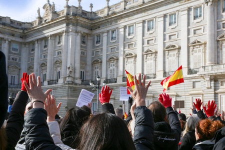A group of self-employed workers are demonstrating in the city of Madrid, demanding respect for their rights while carrying flags, megaphones, and whistles.のeditorial素材