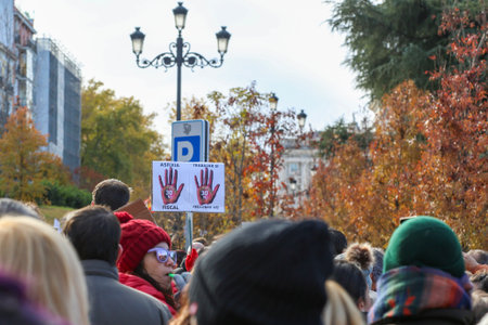 A group of self-employed workers are demonstrating in the city of Madrid, demanding respect for their rights while carrying flags, megaphones, and whistles.のeditorial素材