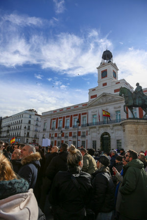 A group of self-employed workers are demonstrating in the city of Madrid, demanding respect for their rights while carrying flags, megaphones, and whistles.のeditorial素材