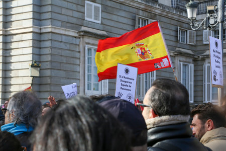 A group of self-employed workers are demonstrating in the city of Madrid, demanding respect for their rights while carrying flags, megaphones, and whistles.のeditorial素材