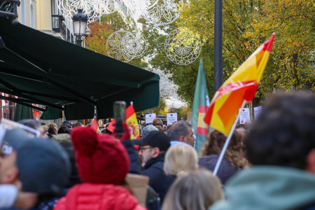 A group of self-employed workers are demonstrating in the city of Madrid, demanding respect for their rights while carrying flags, megaphones, and whistles.のeditorial素材