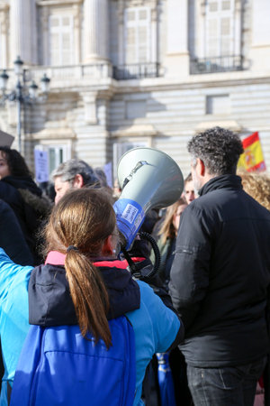 A group of self-employed workers are demonstrating in the city of Madrid, demanding respect for their rights while carrying flags, megaphones, and whistles.のeditorial素材