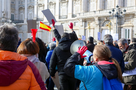 A group of self-employed workers are demonstrating in the city of Madrid, demanding respect for their rights while carrying flags, megaphones, and whistles.のeditorial素材