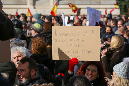 A group of self-employed workers are demonstrating in the city of Madrid, demanding respect for their rights while carrying flags, megaphones, and whistles.のeditorial素材