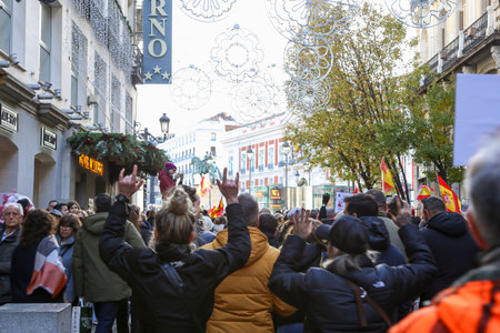 A group of self-employed workers are demonstrating in the city of Madrid, demanding respect for their rights while carrying flags, megaphones, and whistles.のeditorial素材