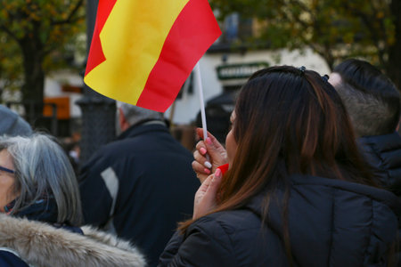 A group of self-employed workers are demonstrating in the city of Madrid, demanding respect for their rights while carrying flags, megaphones, and whistles.のeditorial素材