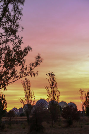 Spherical LPG fuel tanks in white and red colors at a facility near the city of Madridのeditorial素材