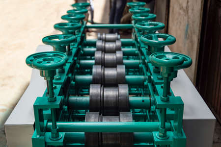 Closeup of a metal shaft parts of Lathe Machinery. Vintage Industrial Machinery in a old factory. Selective focus.の写真素材