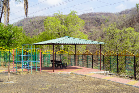 Beautiful scenic view of an hut and a bench at mountain village Kalakund near Mhow, Indore, Madhya Pradesh on a sunny summer day. Indian village.の写真素材