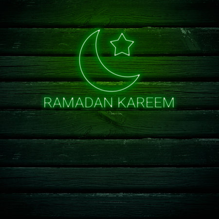 Ramadan Kareem text on wooden background. Greeting for Ramadan Mubarak, Eid Mubarak. Happy Ramadan, Happy Eid Greeting Card Idea. Holy Month. Copy Space.の写真素材