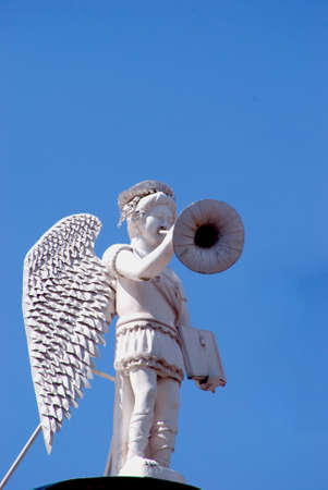 white angel with trumpet and book in handsの写真素材