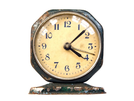 Ancient rusty metal clock. Vintage retro object isolated on white background. の写真素材