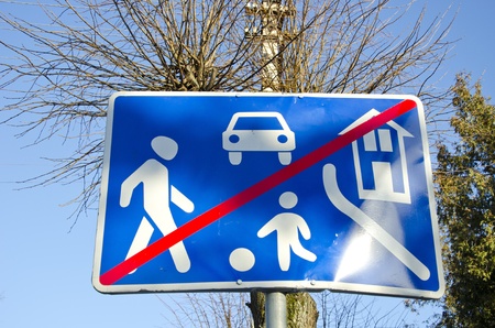 Informational road sign mean end of village. Restrictions zone end. の写真素材