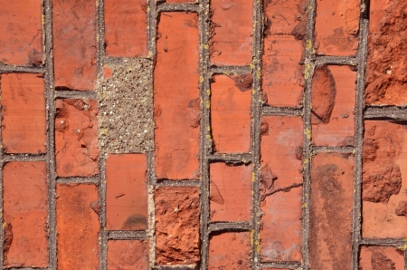Fragment of old squared red brick wall の写真素材