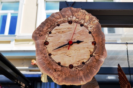 Handmade wooden clock decorated with amber flint stones  