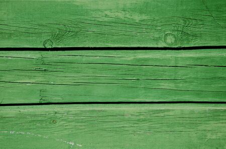 Background of green paint wooden board wall closeup  の写真素材