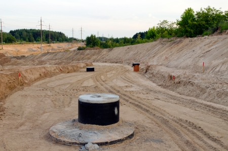 Road construction preparations  Gravel filled and sewage wells  