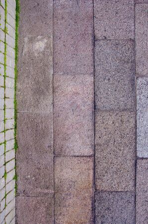 Block wall and tiled path fragments. Construction background.の写真素材