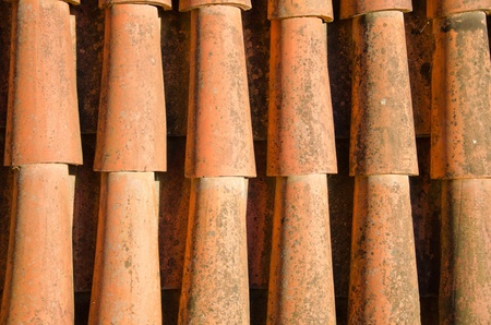 Background of clay round tiles covered roof closeup の写真素材