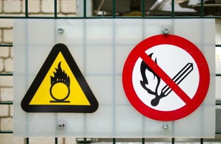 Fire warning signs near compressed oxygen gas cylinders  