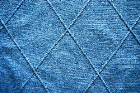 Cross lines on knitted sweater pattern fabric background.  