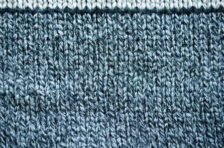 Knitted wool texture background of grey and black color  
