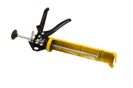 yellow silicone glue gun tool for waterproof works isolated on white background の写真素材