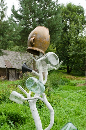 handmade wooden decor stove dry tool for glass clay pots jar in rural farm house yard garden  の写真素材