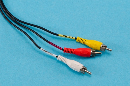 closeup of colorful tulip video audio tv cable wires on blue background  red yellow and white connectors plugs  の写真素材