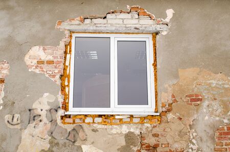 new plastic window in old abandoned brick wall fixed with special foam  simple house renovation  