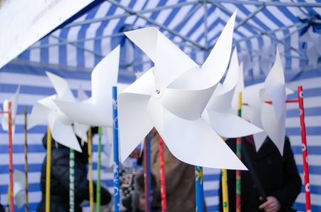 paper windmills sell in outdoor street donation charity event for poor lonely kids. の写真素材