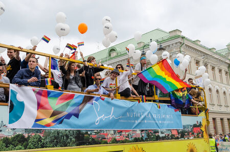 VILNIUS, LITHUANIA - JULY 27: open bus rides large group of participants in the Baltic pride gay...