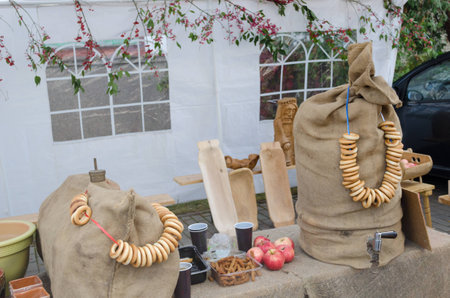 mead barrel hidden under linen bags decorated with crispy string in autumn fair の写真素材