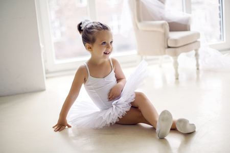 little ballerina girl 2 years in the Studio in a white tutu dress clothesの写真素材