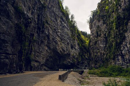 mountain gorge with a road and a forest, in Abkhazia in the springの写真素材