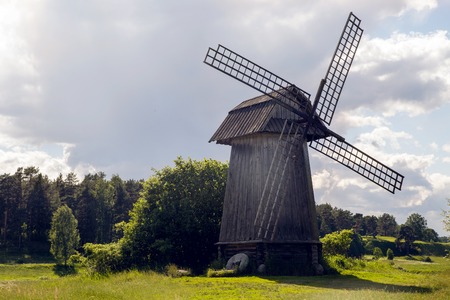 old mill on a green field in summerの写真素材
