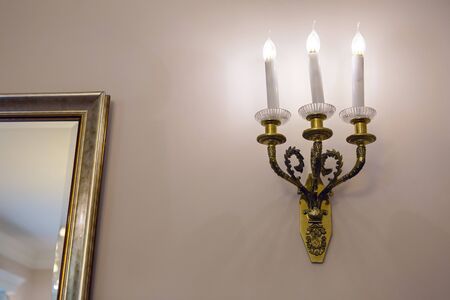 electric wall Golden lamp in the shape of candles
