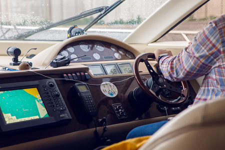 Saint Petersburg, Russia - 18 June : dashboard small yachts that take tourists along the Neva river. at the helm sits a man is 40 years oldin international kissing day on 18 June, 2016.のeditorial素材