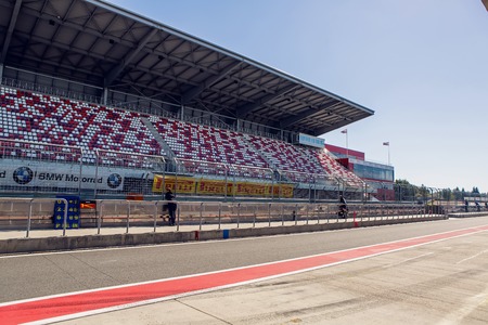 Moscow region, Russia - 27 August : route Moscow raceway with seats and people standing in the road outside the fence empty track before the race riders in day of Russian cinema 27 August, 2016.のeditorial素材