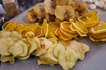 small white meringues with poppy seeds on a gray backgroundの写真素材