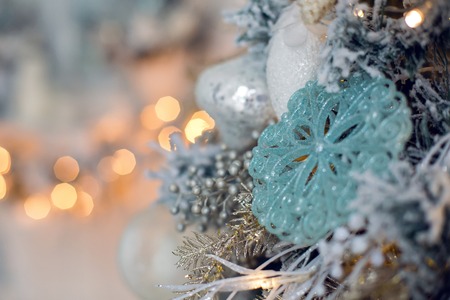 Christmas tree in the room in the snow, decoratedの写真素材