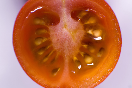 fresh cherry tomatoes in the section in the macroの写真素材