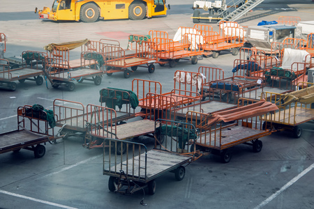 empty carts for Luggage standing in airportの写真素材