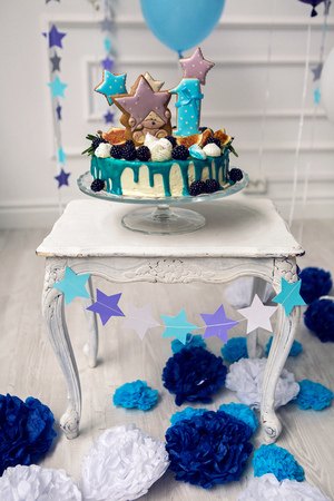 cake with berries on the first day of the birth of a childの写真素材