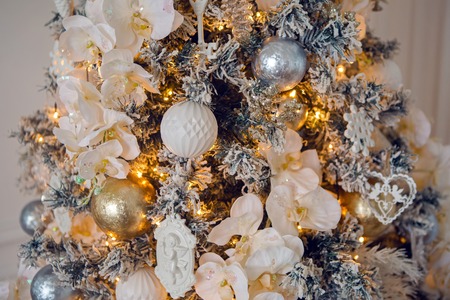 Christmas tree decorated with white holiday light toysの写真素材