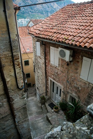 building with orange clay tiles and the windows open in Kotor Montenegroの写真素材