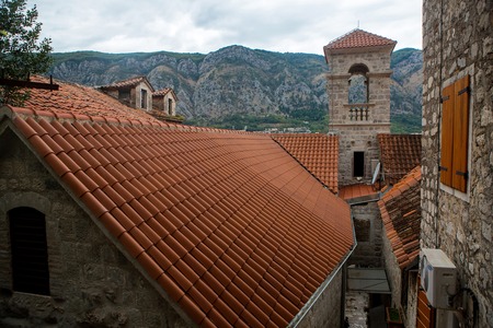 building with orange clay tiles and the windows open in Kotor Montenegroの写真素材