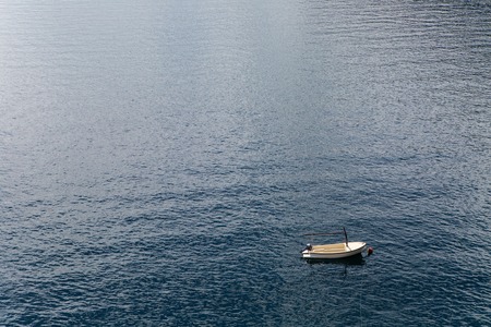 white boat with oars berth at sea